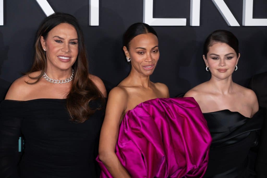 From left to right: Gascón, Saldana, and Gomez at a premiere. Credit: Shutterstock/Featureflash Photo Agency