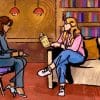 Interviewer and interviewee talking surrounded by books.
