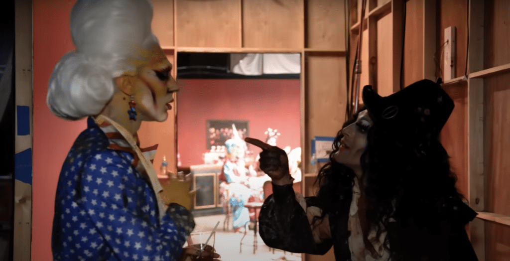 A screenshot of the trailer for Dragula season 6 shows two competitors arguing backstage.