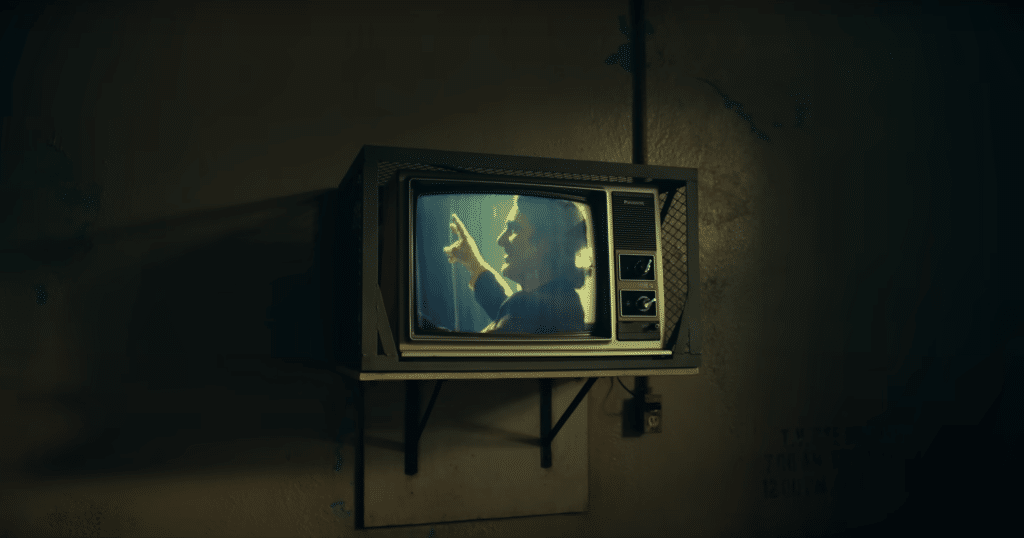 A screenshot of the trailer for "Joker: Folie À Deux" showing Arthur Fleck, "Joker", on television.