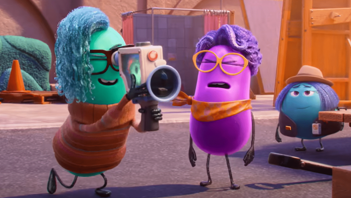 Xeni (Richard Ayoade, left) bugs director Paula (Paula Pell, right) on the film lot. Credit: Pixar