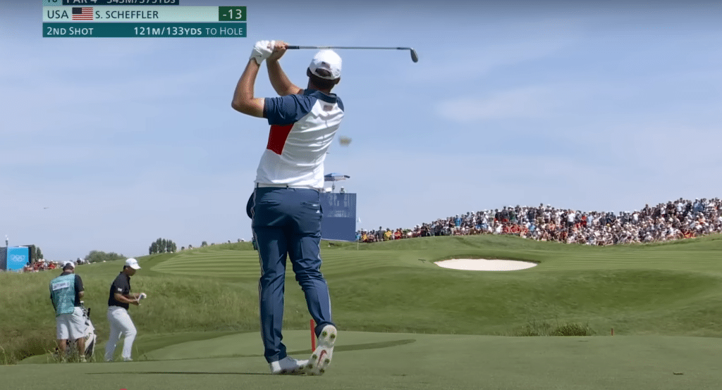 Scottie Scheffler hitting a shot at Le Golf National during the final round of the Men's Individual Strokeplay Championship at the 2024 Olympics in Paris.