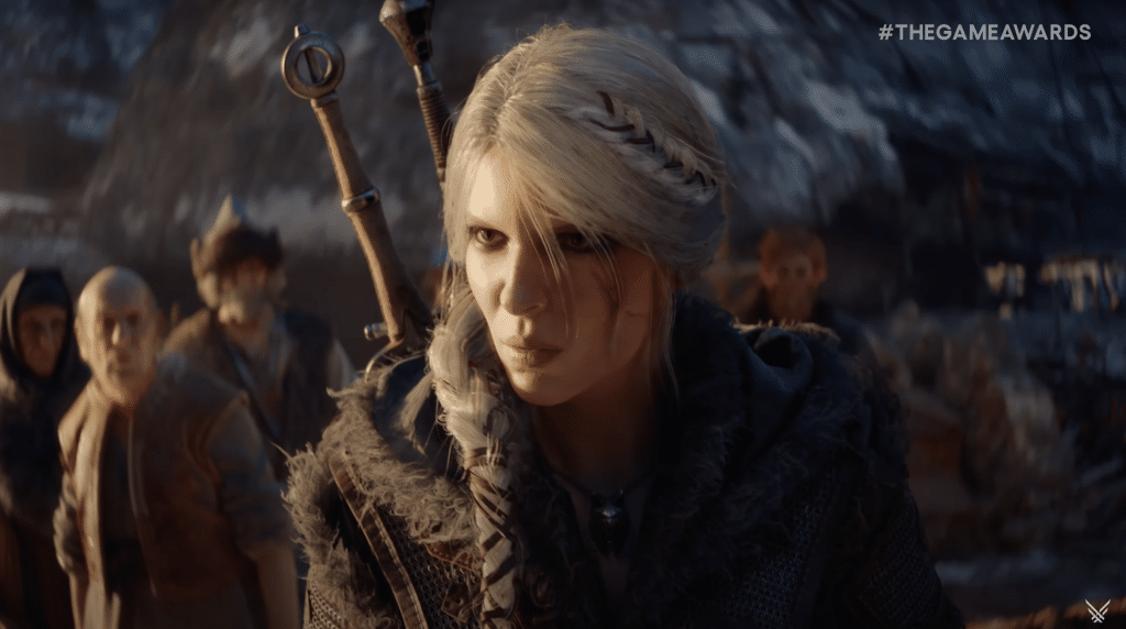 A white-haired woman carrying multiple swords stares angrily at someone off-camera.