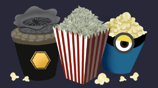 On the left is the Dune popcorn bucket. In the middle is a regular red and white striped popcorn bucket with money on it. On the right is a minions-themed popcorn bucket with popcorn in it.