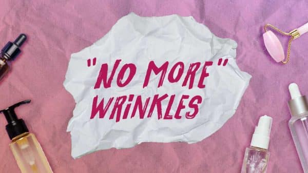 An image with skincare products laid out on a table. In the middle is a piece of paper that reads "No more wrinkles"