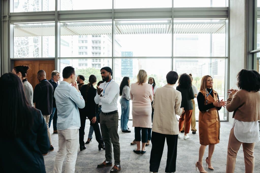 A group of people seemingly networking at an event.
