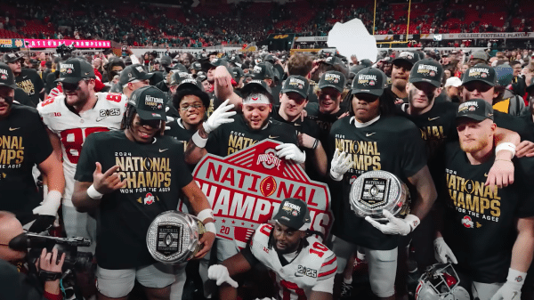Ohio State Football players celebrating the National Championship win with their teammates.