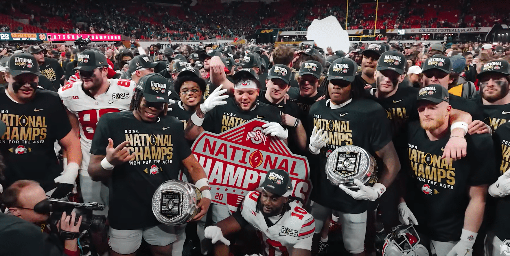 Ohio State Football players celebrating the National Championship win with their teammates.