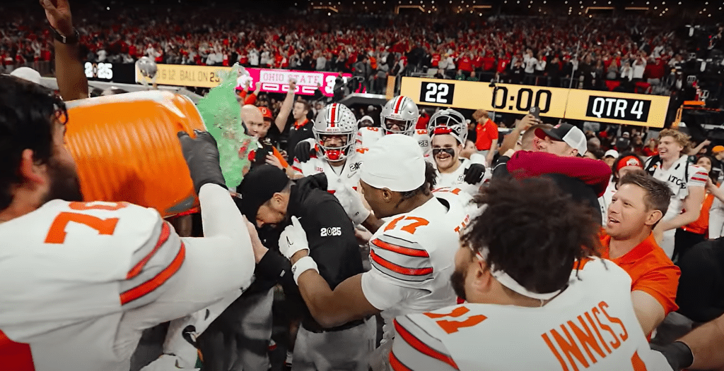 Ohio State players dumping Gatorade on head coach Ryan Day after winning the National Championship.