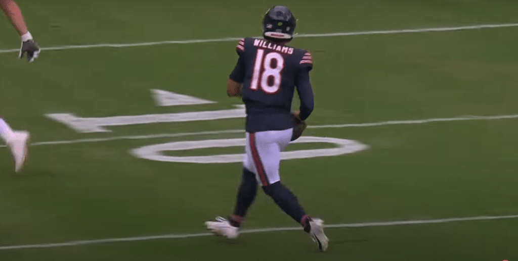 Bears quarterback Caleb Williams scrambles left looking for the endzone in preseason.