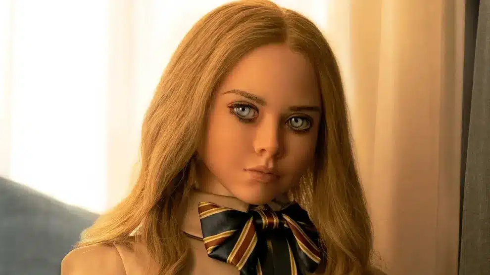 The M3GAN doll looks menacingly into the camera. 