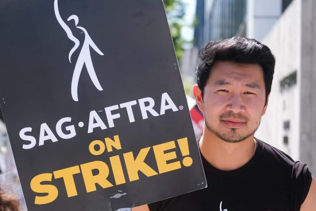 Actor Simu Liu on strike with SAG-AFTRA back in 2023. Credit: Shutterstock/Ringo Chiu