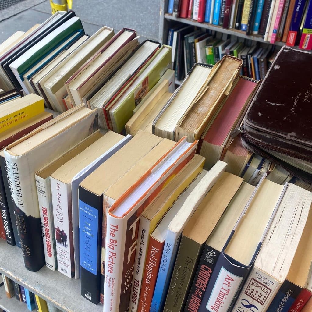 Stack of books on a trolley outside an NYC bookstore