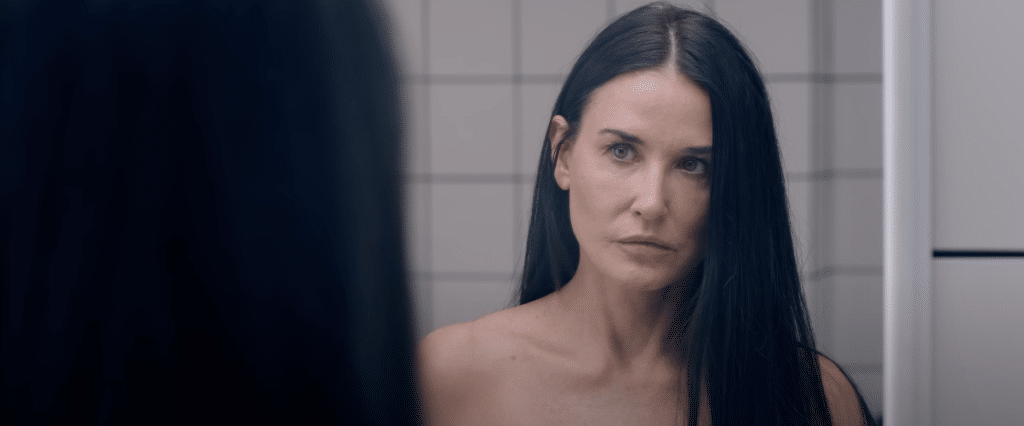 A shot of a woman (Elisabeth) looking in a mirror