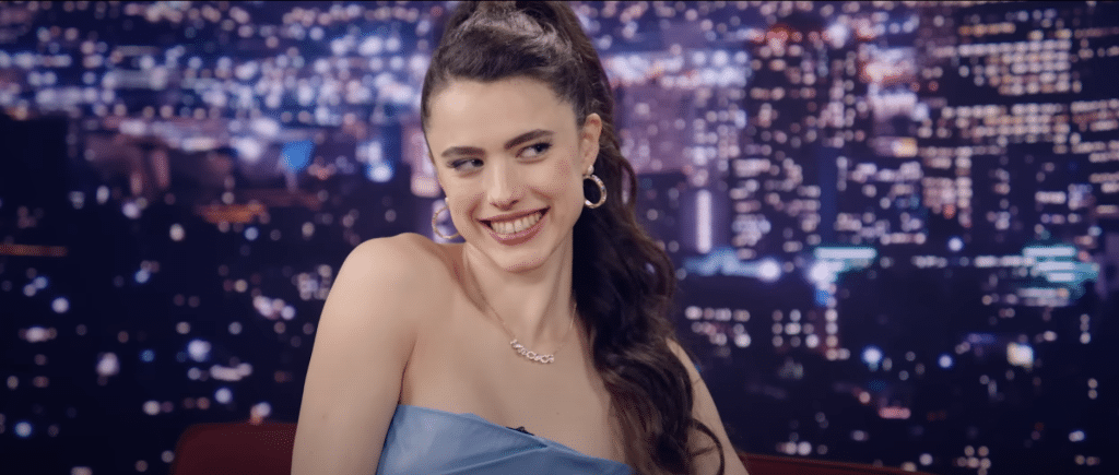 A woman (Sue) smiling on a talk show