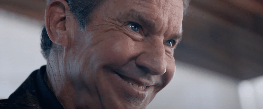 A shot of a man's (Harvey's) face scarily smiling