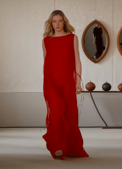 Model in a maxi chiffon red dress at the Altuzarra Fall/Winter 2025 New York Fashion Week show.