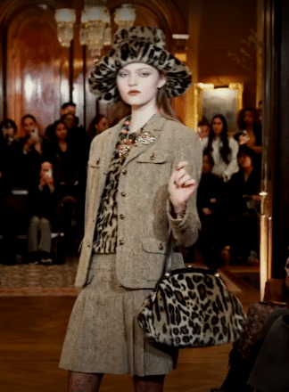 Model wearing a tan skirt suit with leopard accessories at Anna Sui's Fall/Winter 2025 New York Fashion Week Show.