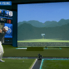 TGL player during a swing into the 150-foot simulator screen.