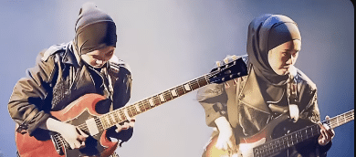 Voice of Baceprot's Enter Sandman Cover song. The guitarist and bassist playing next to each other.