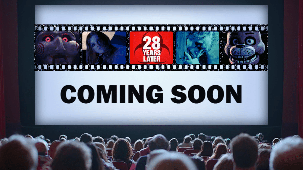 A theater filled with viewers look at a screen filled with five horror movie images and the words "Coming Soon."