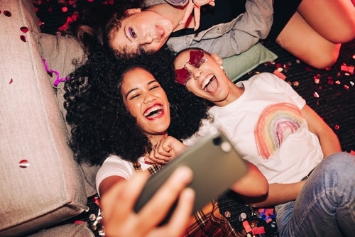 Group of cheerful female friends having fun together on the weekend.