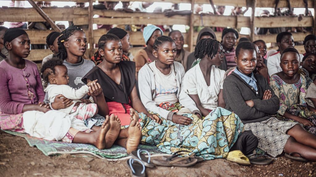 These poignant editorial photos capture the harsh reality and suffering of displaced children in a camp located in the city of Goma. Image: Shutterstock/AkinDesign