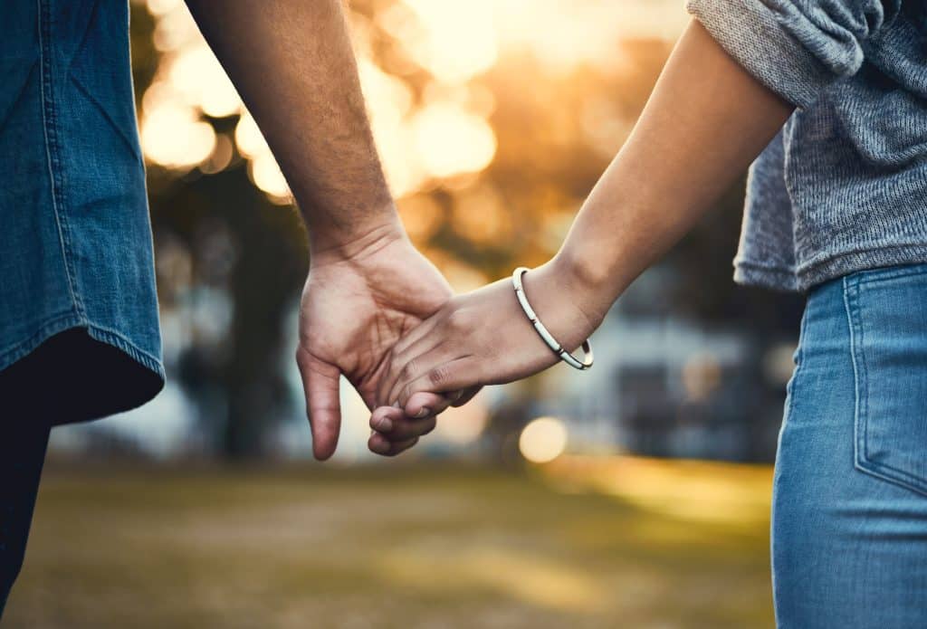 two people holding hands