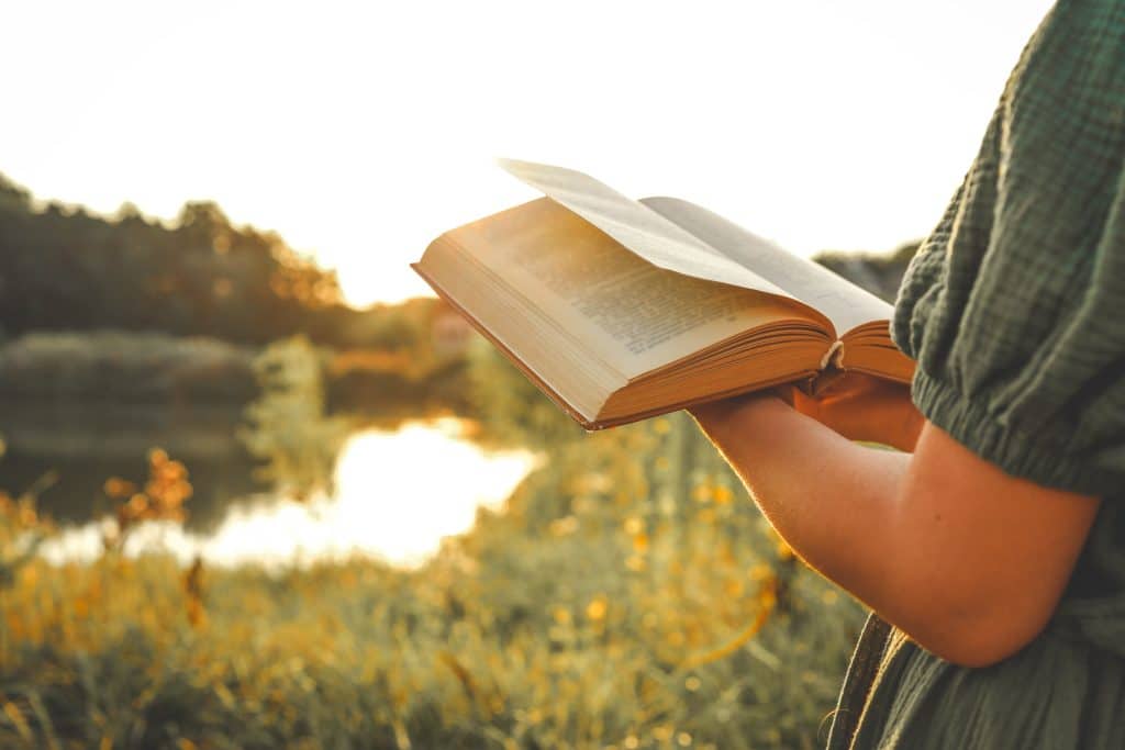 Woman reading outside.