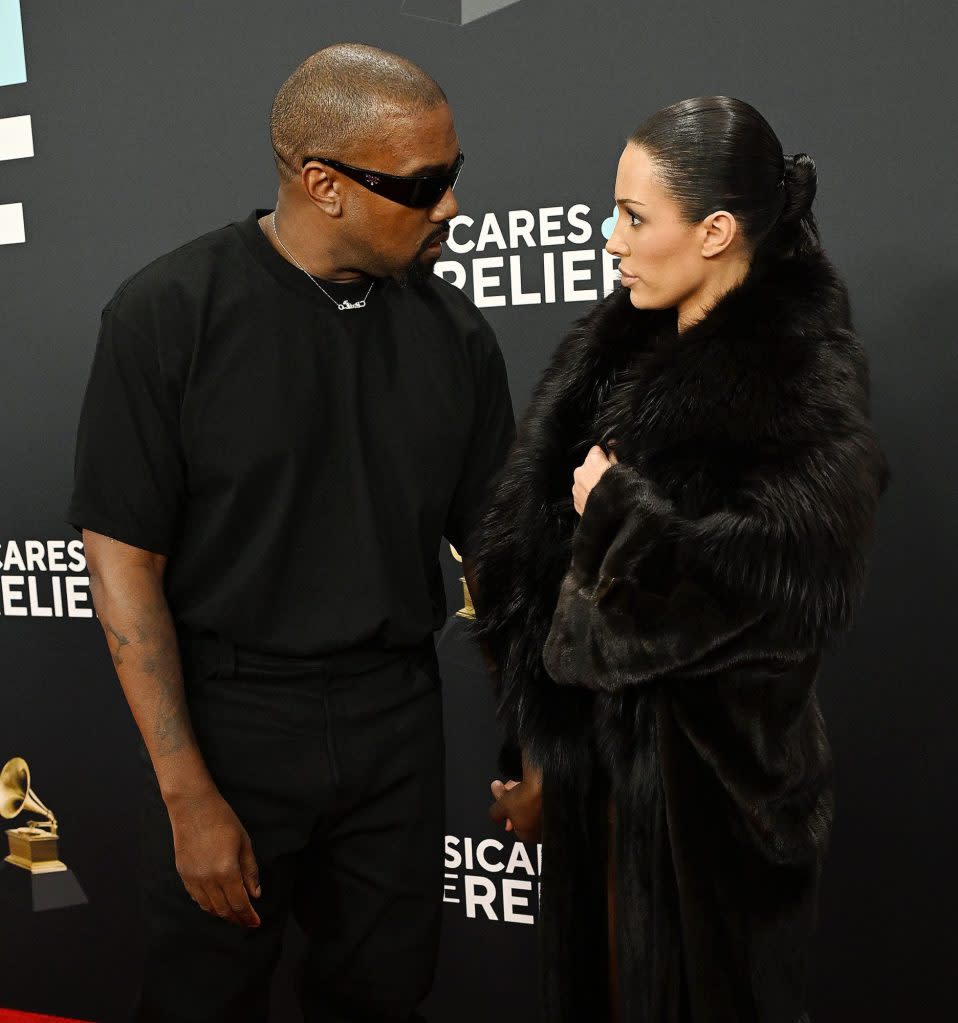 Kanye West and Bianca Censori have an exchange. Credit: Fernando Allende/Shutterstock