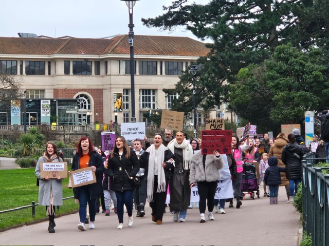 People marching with signs.