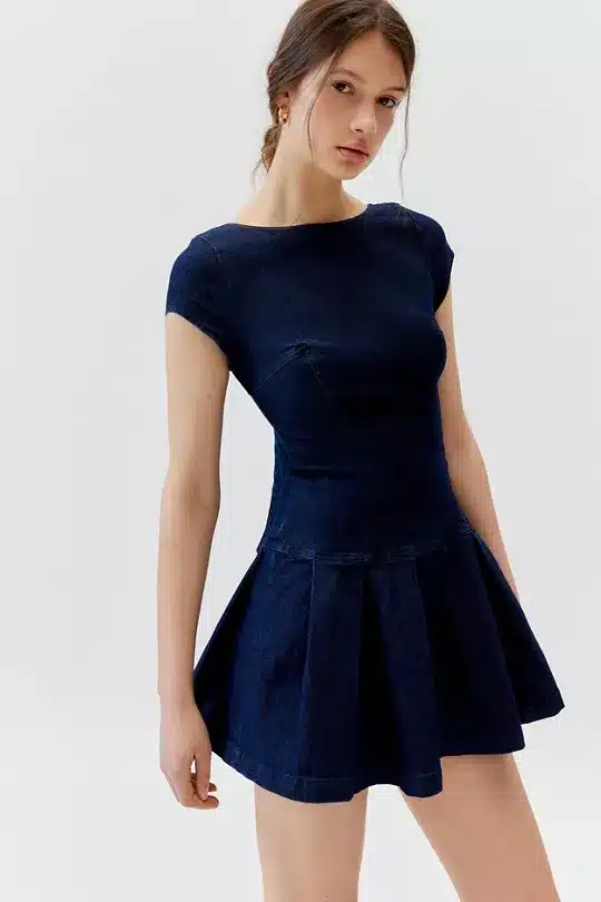 UO Bryan Bow-Back Pleated Denim Mini Dress.