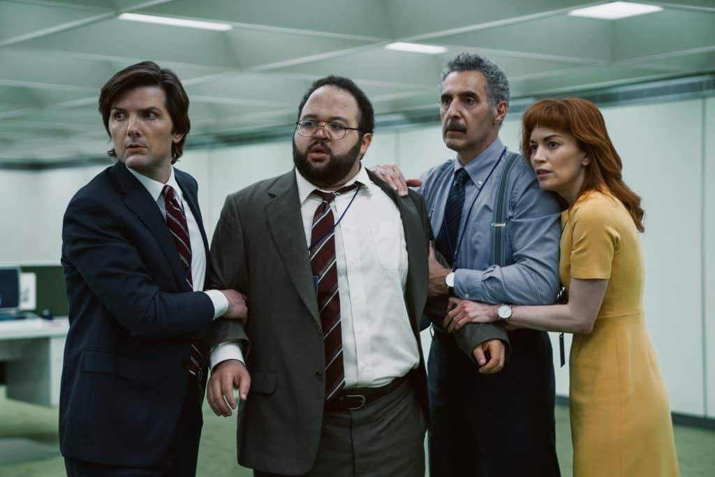 Adam Scott, Zach Cherry, John Turturro, and Britt Lower in Severance. (Image: Apple TV+)