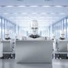 3D rendered image of humanoid AI robots working on laptop computers. Image: Shutterstock/Phonlamai Photo