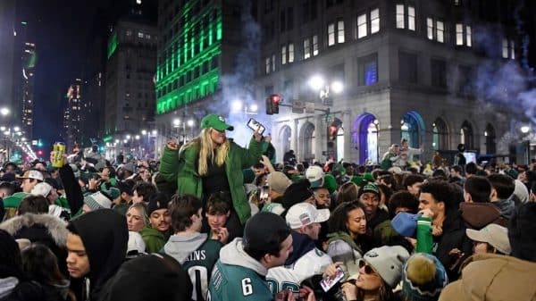 Alt text: Hundreds of Eagles fans crowd Broad Street to celebrate after the 2025 Super Bowl win.