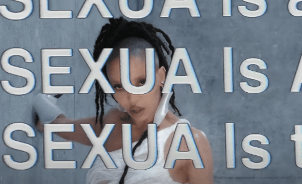 FKA Twigs with bold font covering the screen