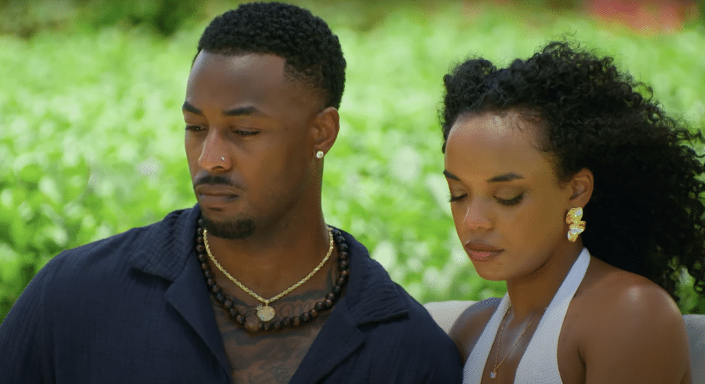 Brion and Shanté sitting down with worried expressions.