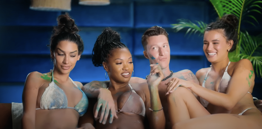 Grant in his confessional interview accompanied by 3 of the Tempters in his villa.