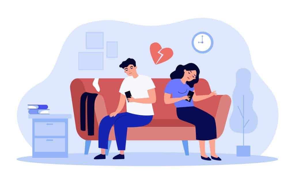A couple sitting together doom scrolling, not paying each other any attention. Their relationship is suffering due to the lack of engagement with each other.