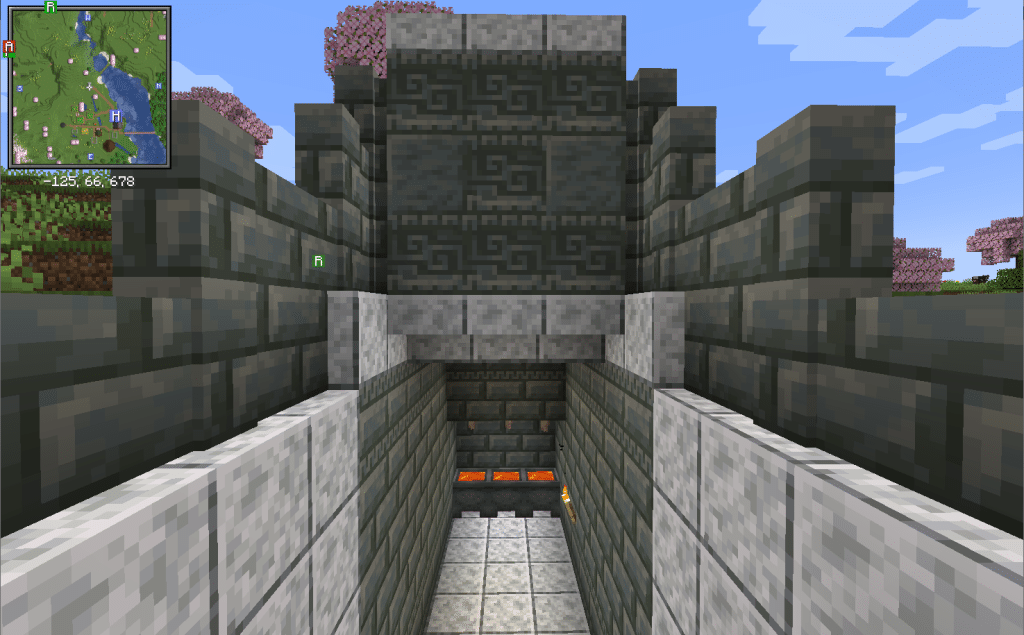 A Minecraft lava farm made out of tuff bricks and polished diorite blocks. A minimap from the Xaero's Minimaps mod is in the corner.