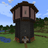 A tower made of deepslate bricks, cherry planks, and dark oak planks in Minecraft. A minimap from the Xaero's Minimaps mod is in the corner.