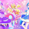 From left to right, Cure Kyun-Kyun, Cure Idol, and Cure Wink jumping against a sparkly background.