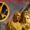 Mockingjay symbol and statues of philosophers over a background of the Hunger Games books.