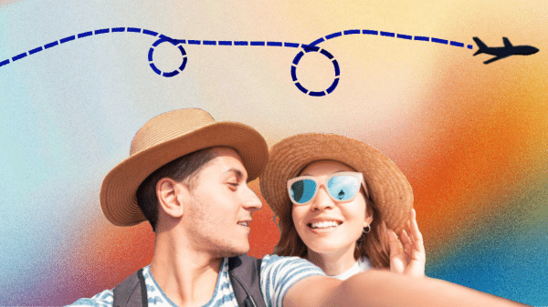 Two people posing for a travel photo with a colorful background.