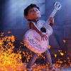 Miguel playing the guitar surrounded by glowing orange marigold petals in Coco. (Credit: Disney/Pixar)