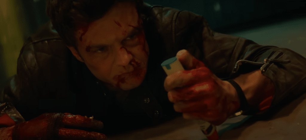 Nate(Jack Quaid) about to inject an epipen for adrenaline