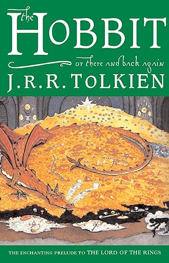 A dragon guards a pile of gold on the cover of the classic fantasy book The Hobbit.