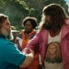 Two men share a deep handshake of respect in A Minecraft Movie.