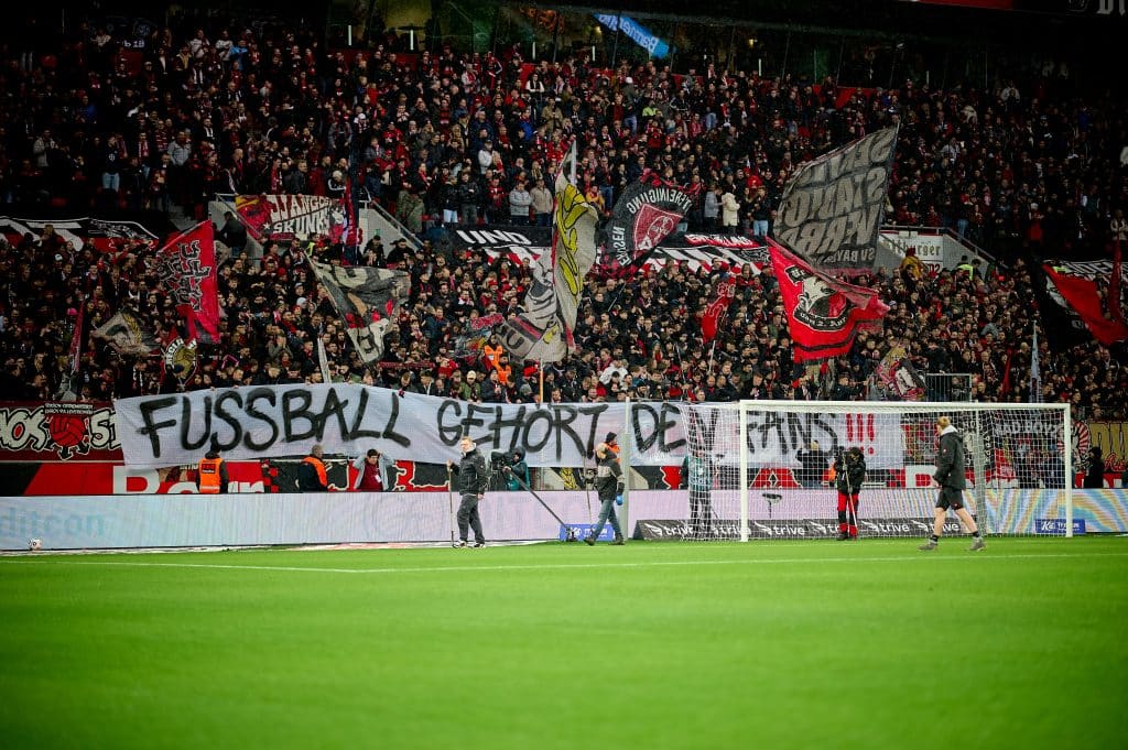 Bundesliga fans hold up a banner that reads "Fussball gehort den fans!" English: "Football belongs to the fans!"