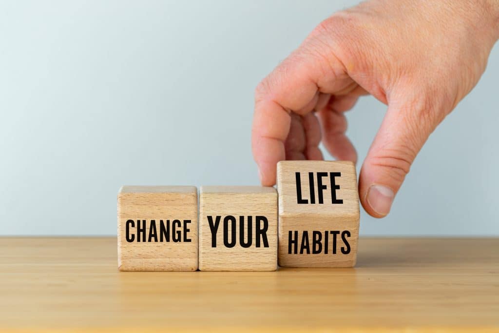 Three blocks next to each other that read "change your habits"